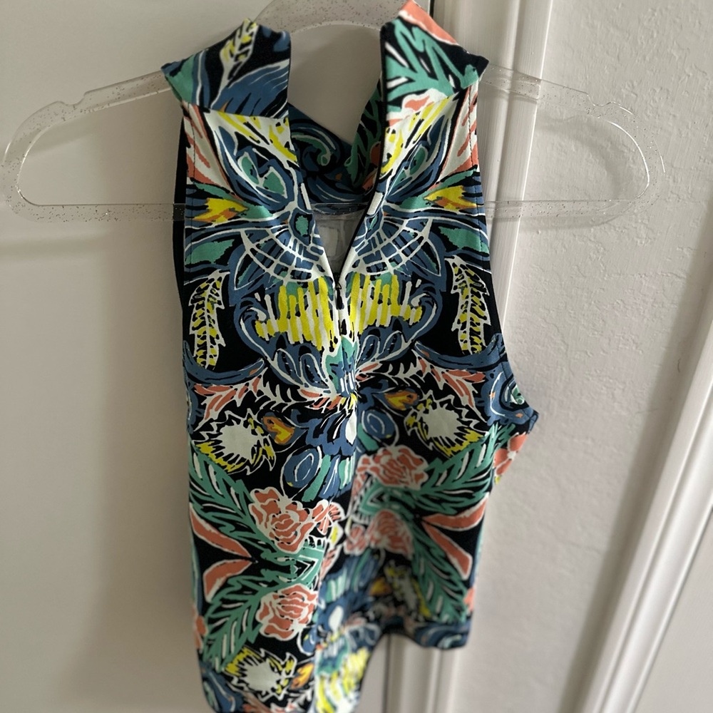 NWT! Free People Multicolor Floral Bodysuit with adjustable zipper neckline.